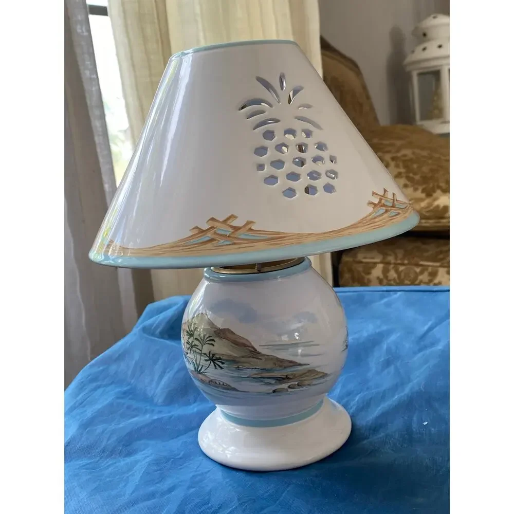 Lenox British Colonial candle lamp featuring a scenic design by Chuck Fischer